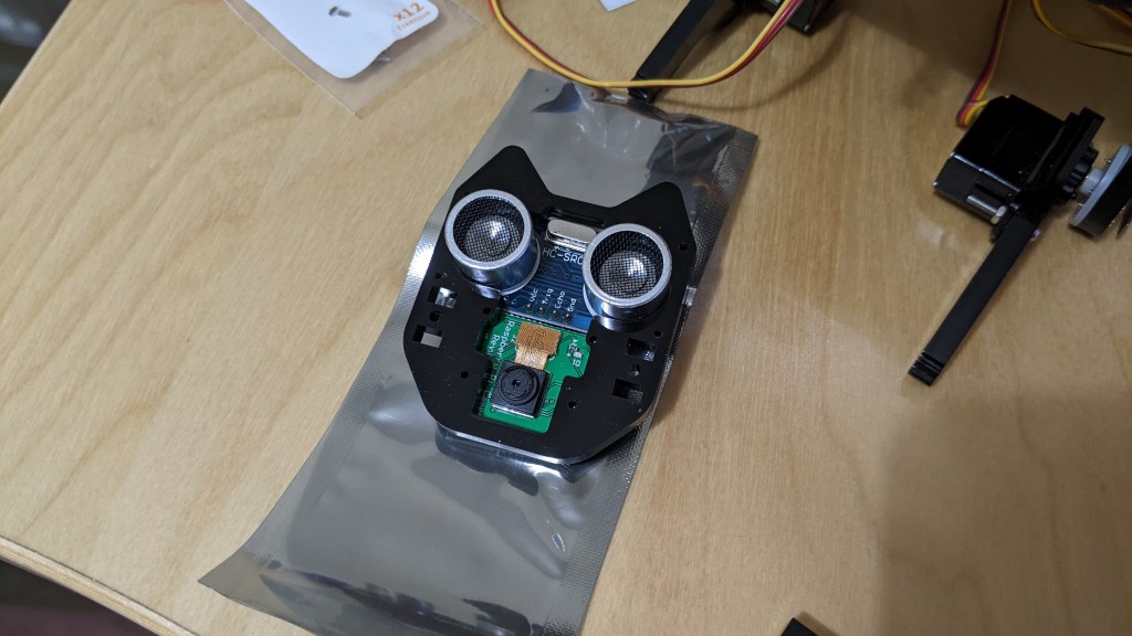 Built the head (minus the face-plate).
This contains an ultrasound module (the eyes) and a camera (the mouth)... slightly backwards conceptually! :D